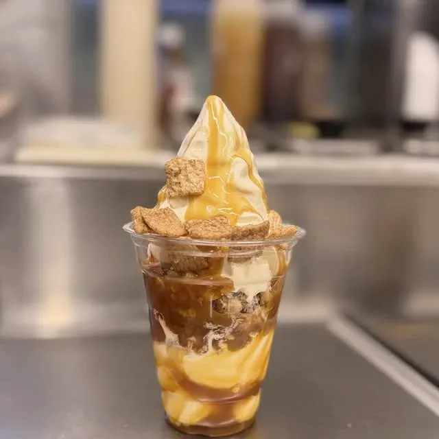 Banana Foster Parfait, layered bananas and caramel with a swirl of soft serve on top