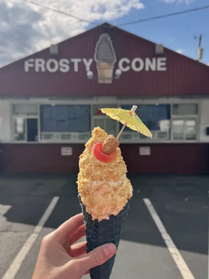 Frosty-cation Cone with crumb topping and a paper umbrella