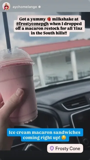 Strawberry milkshake in a car outside the stand